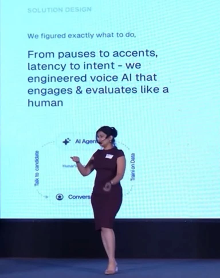 Ira speaking on stage at the EkStep Voice AI Conference